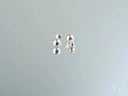 Two 18K white gold 5mm ball earrings with silver reflections