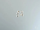 Two 18K white gold 5mm ball earrings with silver reflections