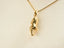 Gold high heel shoe pendant on chain from Golden Steps shoes pendant art gold jewelry collection
