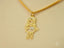 Golden Treasures Pendant featuring an 18k solid gold necklace with a cutout girl and diamond bow