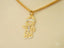 Gold-toned boy-shaped pendant with diamond accents on chain, part of Golden Treasures Pendant collection