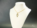 Golden Treasures Pendant: 18k solid gold necklace with girl-shaped pendant