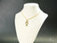 Gold-colored necklace featuring a girl-shaped pendant from Golden Treasures Pendant in 18k solid gold