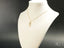Elegant gold chain necklace with abstract Golden Vision pendant, an art gold jewelry piece