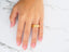 Golden Whisper wedding band on a woman’s hand showcasing art gold jewelry classic fit