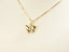 Golden Wings butterfly pendant necklace featuring art gold jewelry and small gem accents