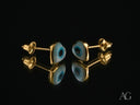 Four 18k gold heart evil eye earrings with blue studs