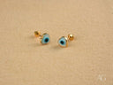 Gold heart evil eye earrings in 18k gold-plated heart studs with blue design