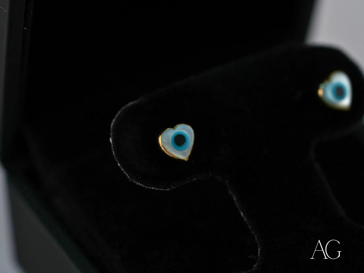 18k gold heart evil eye earrings with blue design