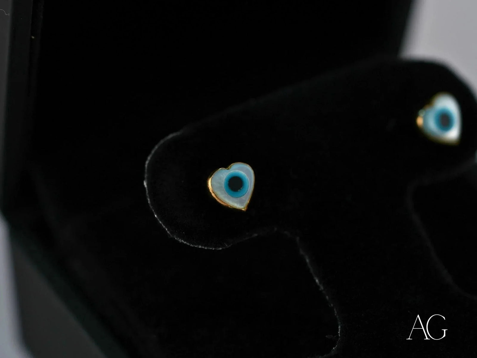 18k gold heart evil eye earrings with blue design