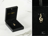 Gold treble clef pendant in Harmonic Elegance, art gold jewelry with gems