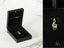 Gold treble clef pendant with embedded gemstones, part of the Harmonic Elegance Pendant art gold jewelry collection
