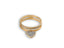 Heart’s Glow Ring featuring a dangling heart charm in radiant 18k gold with pave diamonds