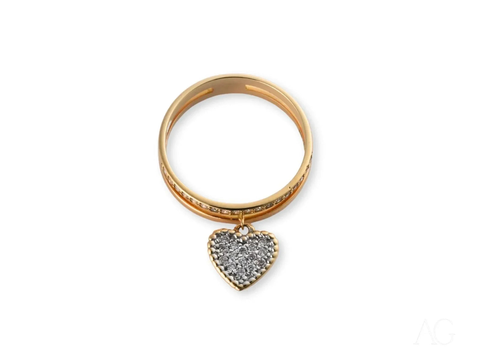 Radiant 18k gold Heart’s Glow Ring with dangling heart charm