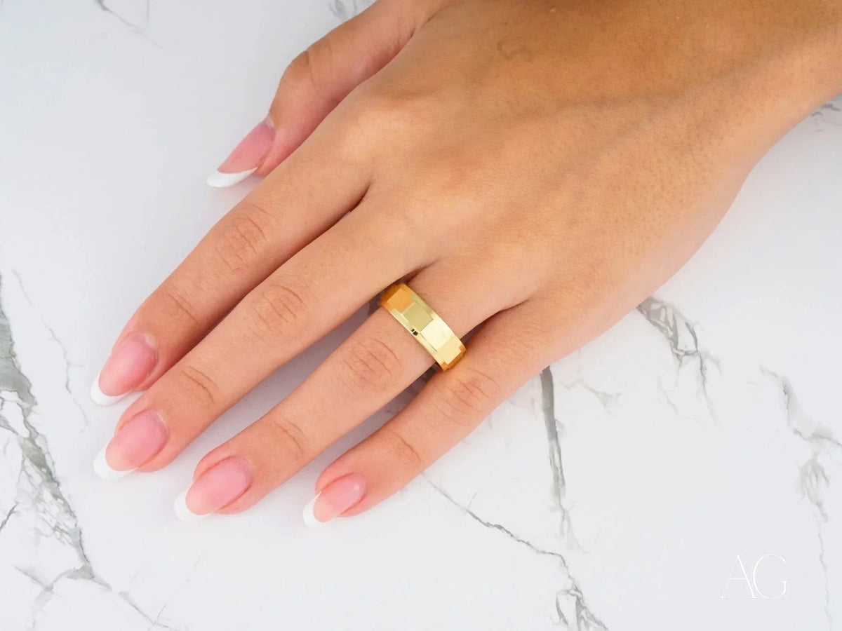 Imperial Facet wedding band in art gold jewelry on hand