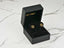 Pair of 18K Gold Green CZ Clover Earrings in an open black velvet jewelry box