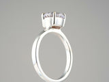 Lumina Promise Solitaire: classic four-prong silver ring with round-cut clear gemstone