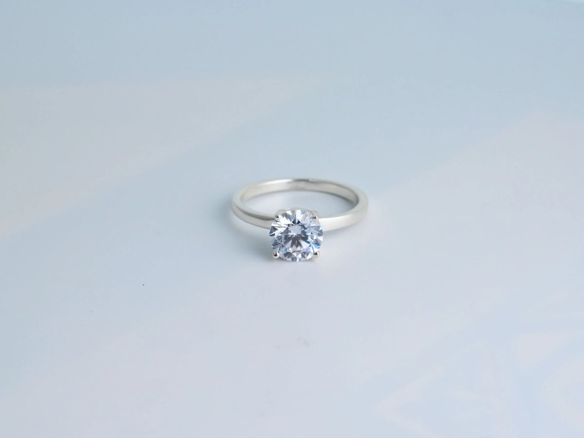 Lumina Promise Solitaire: silver classic four-prong diamond ring