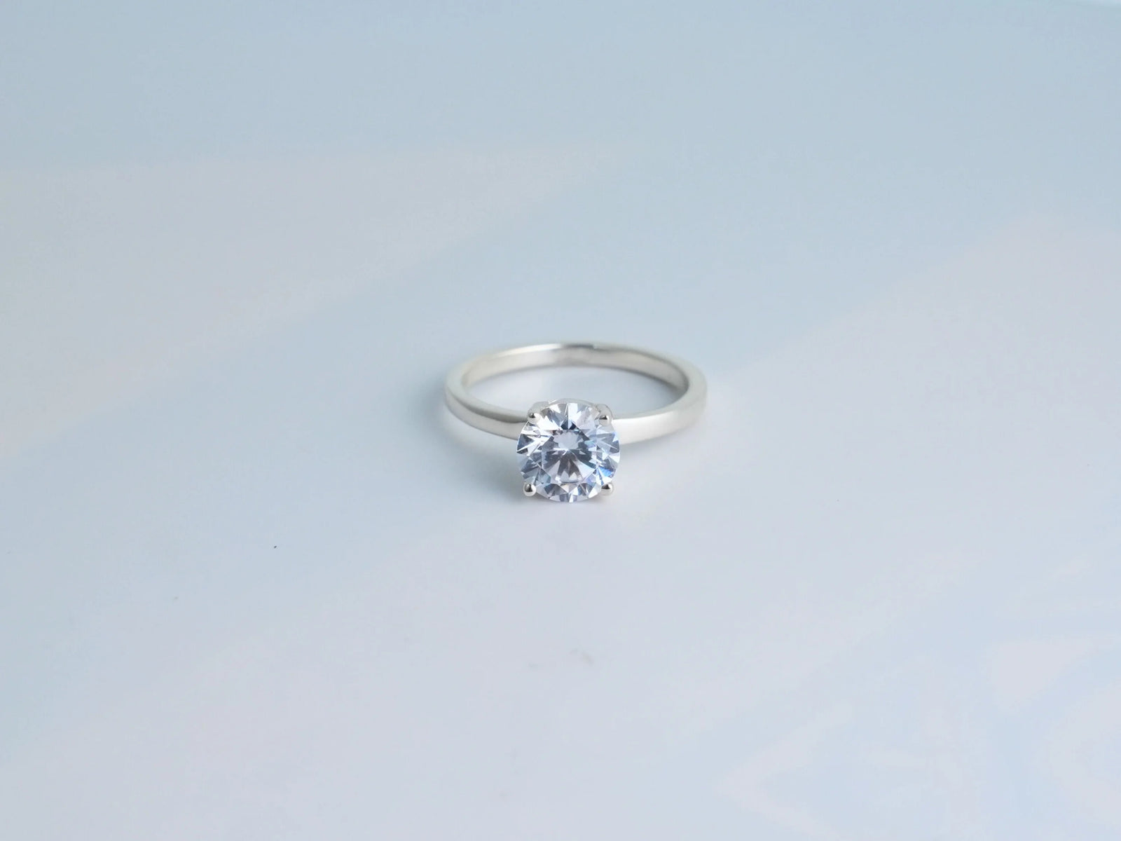 Lumina Promise Solitaire: silver classic four-prong diamond ring