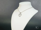 Luminous Heart 18k white gold pendant with textured diamond pattern