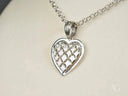 Luminous Heart 18k white gold pendant with intricate cut-out design