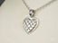 Luminous Heart 18k white gold pendant with intricate cut-out design in art gold jewelry style