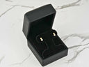 Open black jewelry box with Lustrous Harmony 18K gold pearl drop earrings