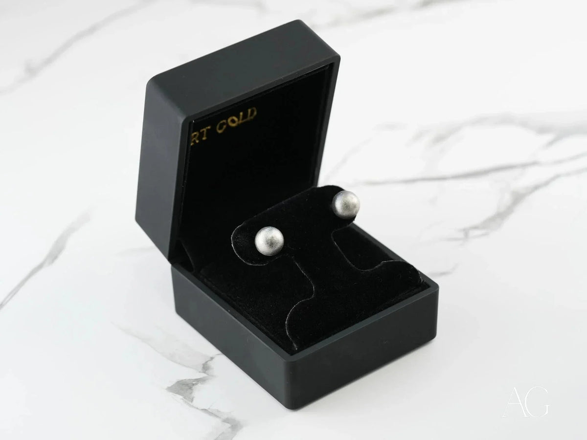 Pair of 18k white gold ball earrings in black velvet box