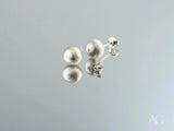 Pair of 18k white gold matte silver ball earrings