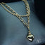 Elegant layered gold necklace with heart pendant, showcasing art gold jewelry and 18k double chain design