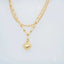 Gold-toned double chain anklet with heart pendant, showcasing luxurious 18k double chain jewelry