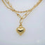 Luxurious 18k double chain anklet with heart pendant, showcasing art gold jewelry elegance