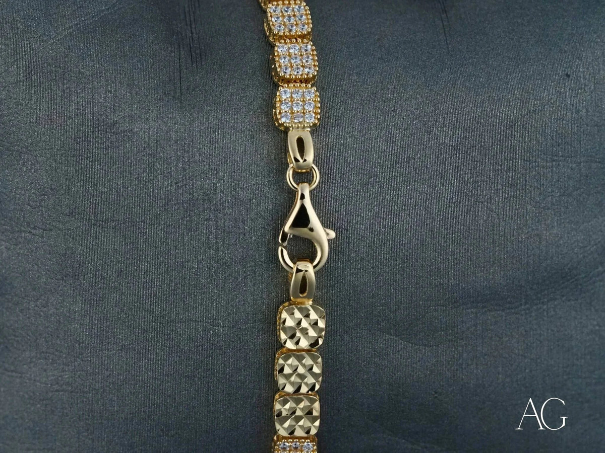 Luxurious solid 18k gold bracelet with alternating rows of pavé cubic zirconia and polished gold links, lobster clasp