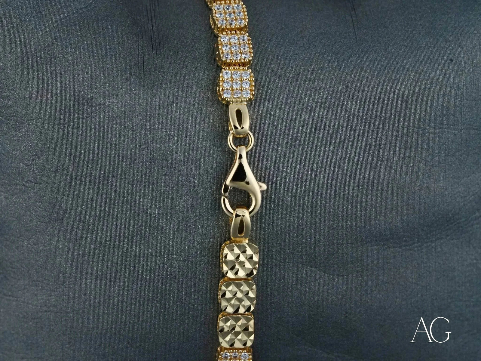 Luxurious solid 18k gold bracelet with alternating rows of pavé cubic zirconia and polished gold links, lobster clasp