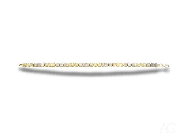 Luxurious solid 18k gold tennis bracelet with alternating rows of polished gold and cubic zirconia