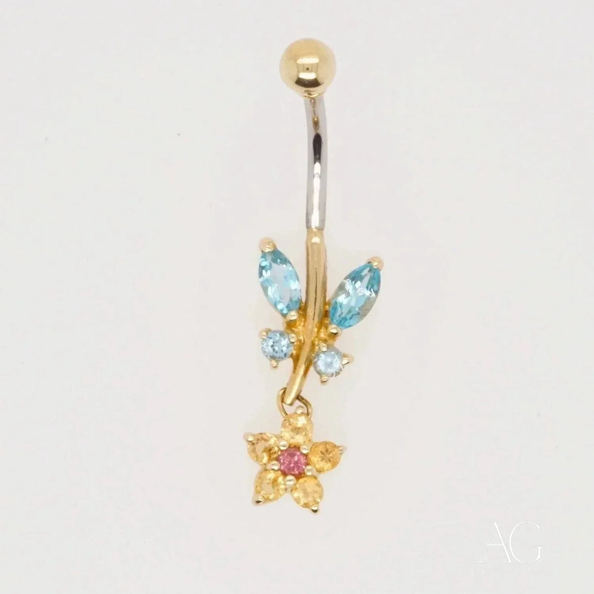 18k gold bellybutton with dangling flower charm and topaz gems