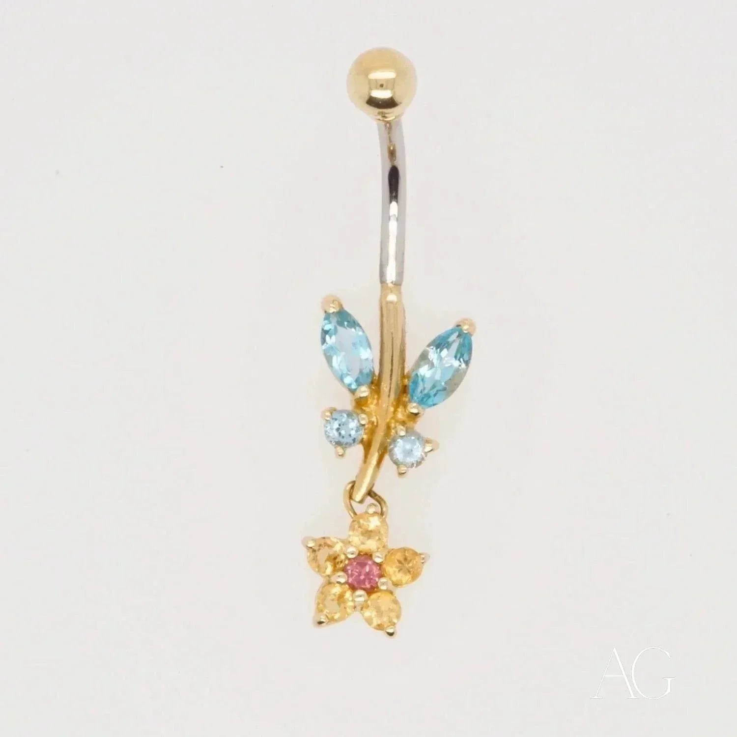 18k gold bellybutton with dangling flower charm and topaz gems