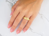 Majestic weave gold wedding band on woman’s hand