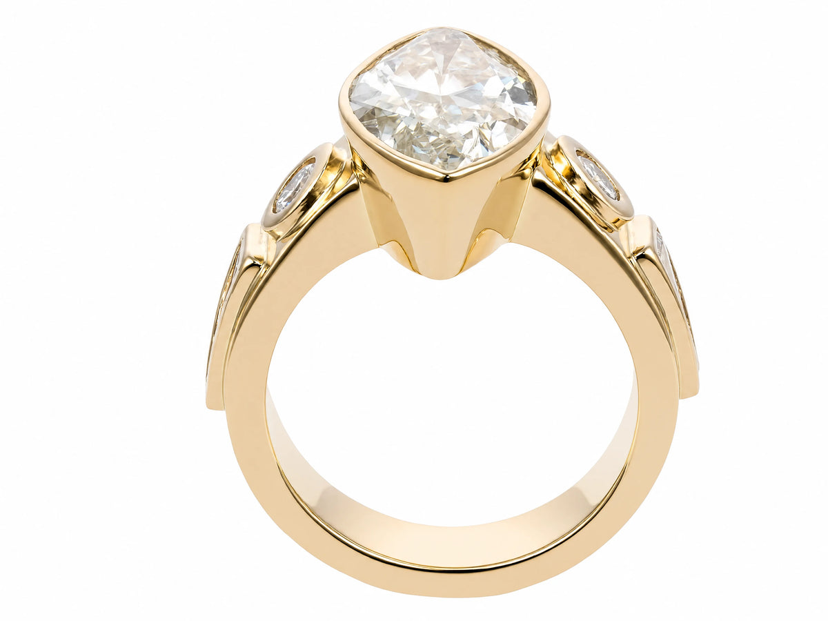 Marquise diamond ring in yellow gold bezel setting showing substantial band and undercarriage, rear three-quarter view