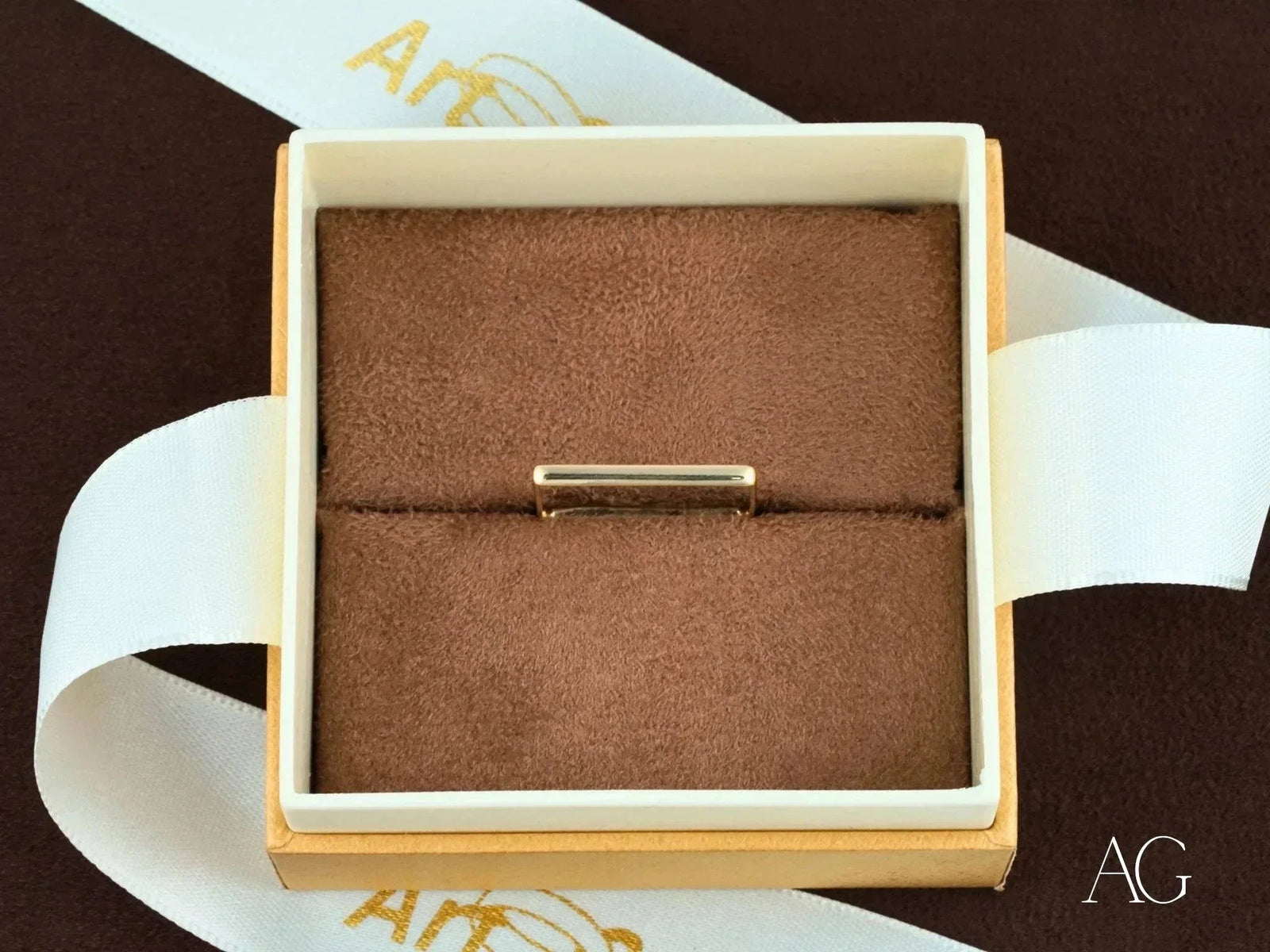 Square shape 18k gold ring in brown velvet box, modern elegance