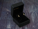 Pair of certified 18k solid gold music note earrings in black velvet box