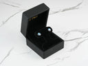 Black velvet box with mystic evil eye stud earrings in 18k gold