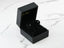 Black velvet jewelry box with 18k white gold black diamond stud earrings from Noir Elegance