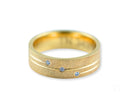 Orbit Lines comfort fit wedding band in textured art gold jewelry with blue gemstones