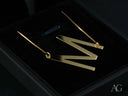 Gold-toned personalized necklace with letter M pendant in 18k gold