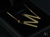 Gold-toned personalized necklace with letter M pendant in 18k gold