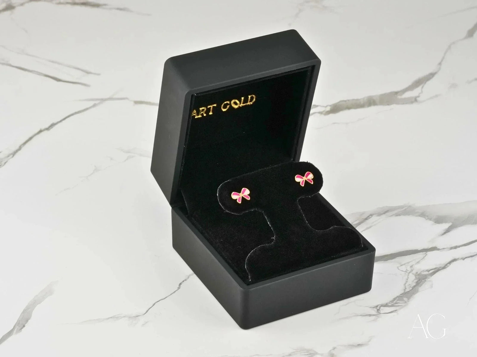 Playful Charm 18K gold pink bow earrings in velvet box