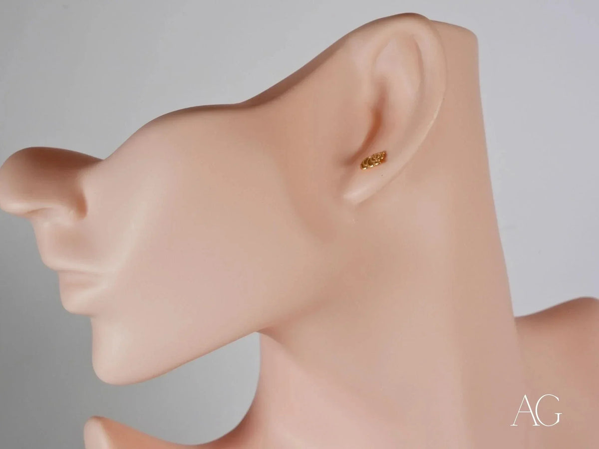 Certified 18k solid gold piglet stud earring on mannequin