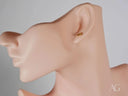 Certified 18k solid gold piglet stud earring on mannequin