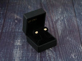 Certified 18k solid gold Playful Piglet stud earrings in black box